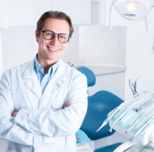 Dentist standing in front of a dental chair