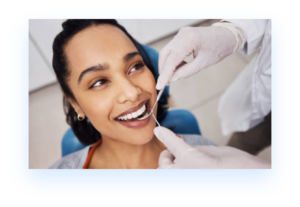 Black woman in dental chair getting general dentistry service