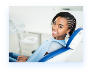 African American teen in dental chair for teeth whitening service in boulder