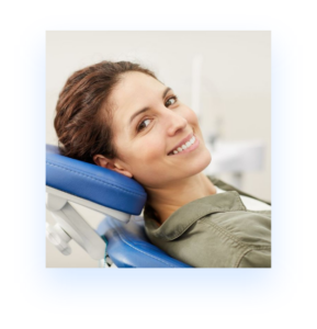 happy brunette woman smiling in dental chair
