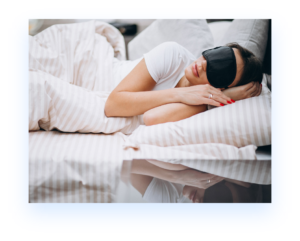 woman sleeping on side in bed with face mask