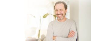 man in 50's smiling - dental implants