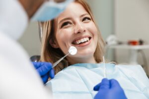 Image of smiling woman sitting in dental chair